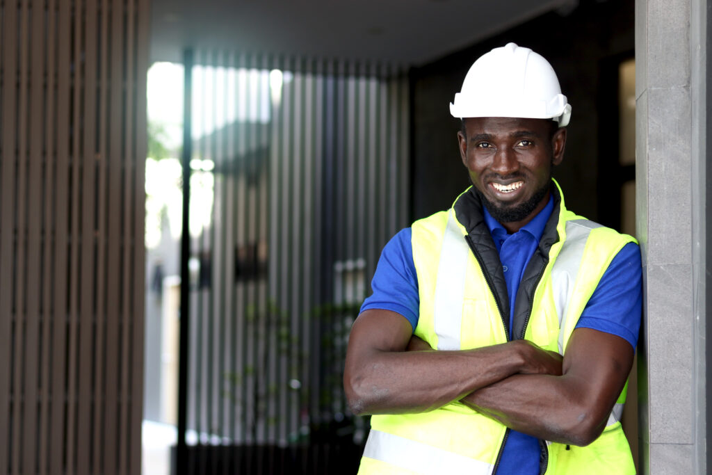 man-in-construction-cloths-with-arms-crossed